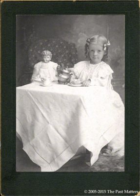 Dana Margaret Williams, 2 Aug 1901, taking tea with her German china doll.